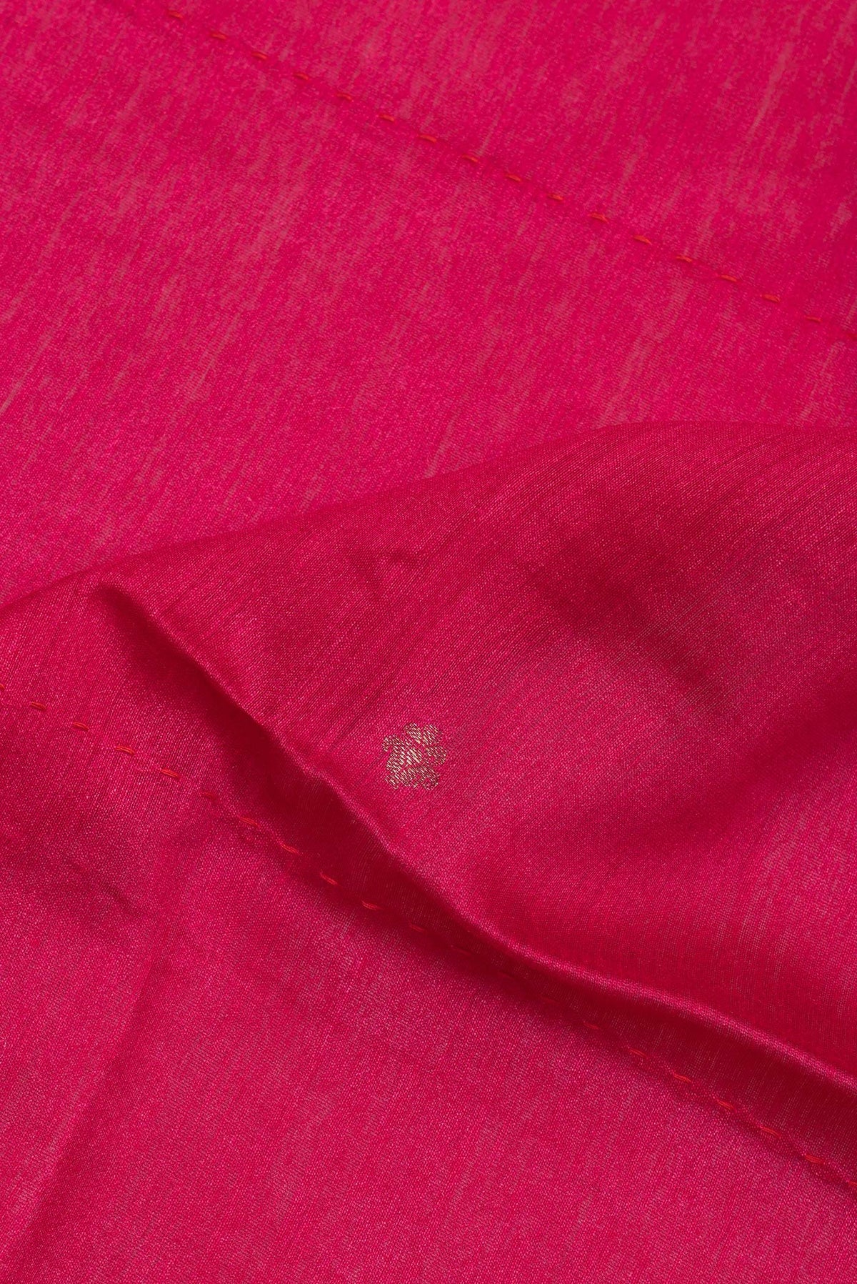 Close up of Pure Silk Dark Pink Dual Tone Tussar Saree with Zari Butta on the body and Fancy Border.  displaying folds