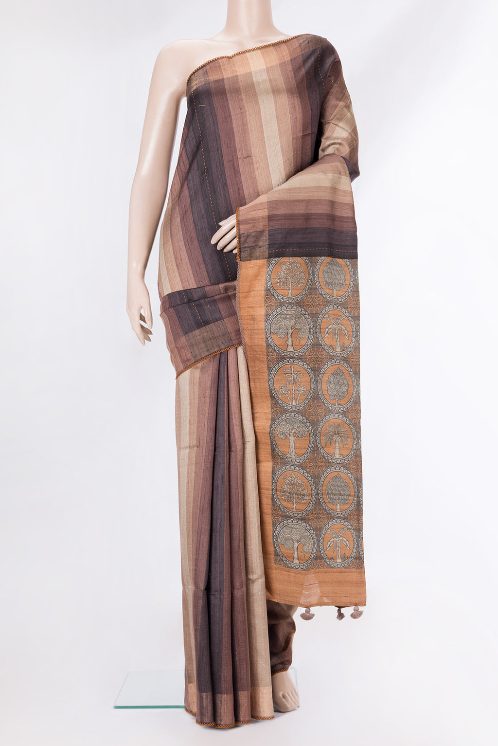 Pure Silk Brown Dual Tone Tussar Saree with Stripes on the body and Embroidery Border.  displayed on a mannequin