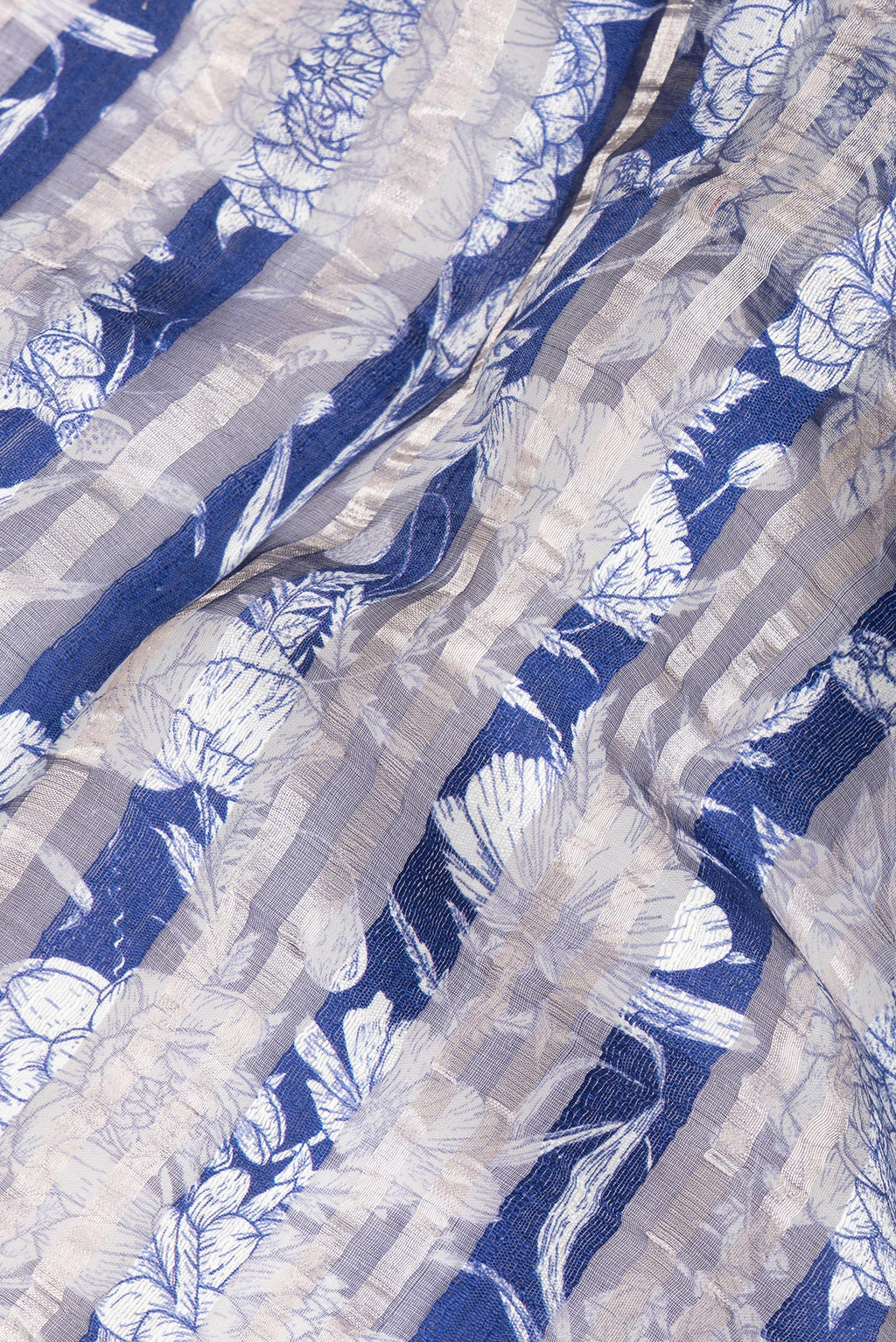Close up of Pure Silk Royal Blue Dual Tone Tussar Saree with Printed design on the body and Fancy Border.  displaying folds