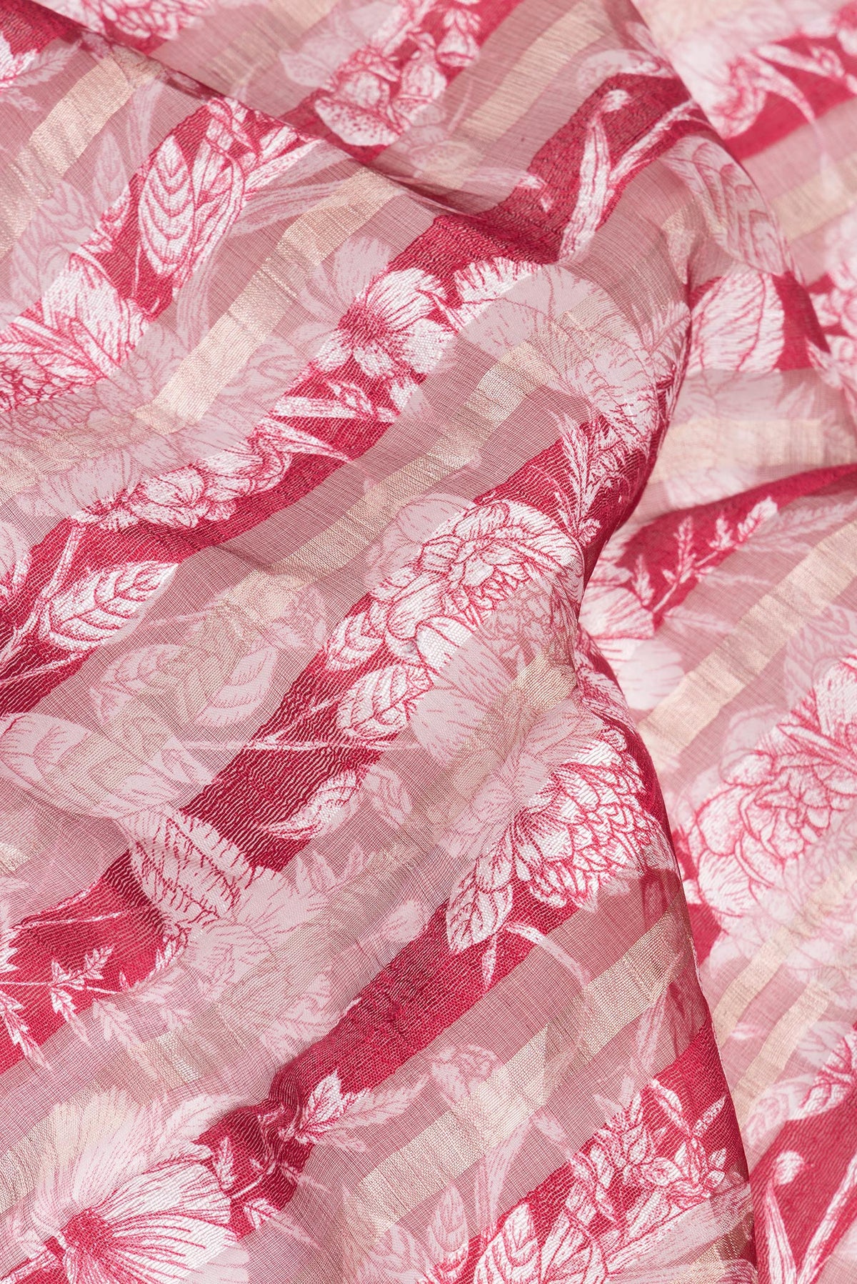 Close up of Pure Silk Maroon Dual Tone Tussar Saree with Printed design on the body and Fancy Border.  displaying folds