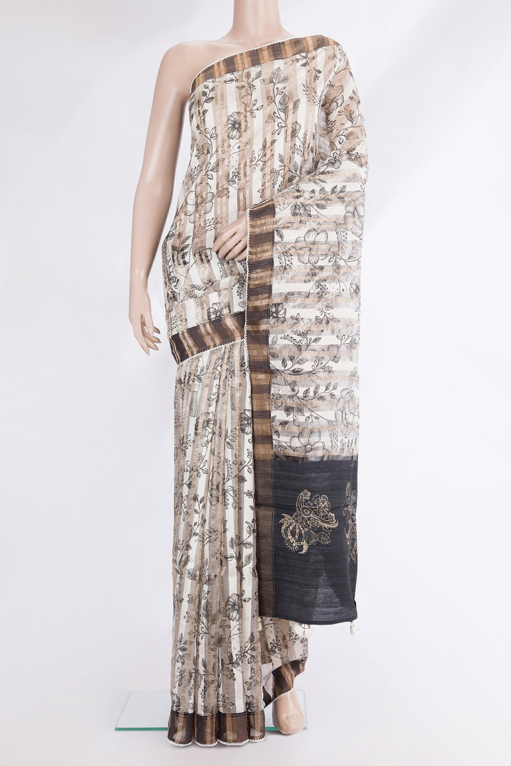 Pure Silk Off White Dual Tone Tussar Saree with Printed design on the body and Fancy Border.  displayed on a mannequin