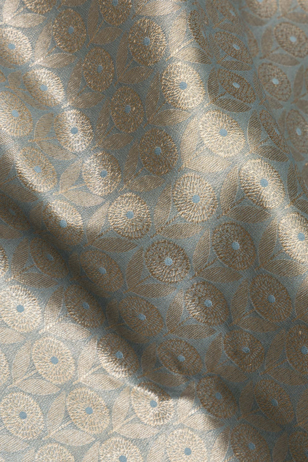 Close up of Pure Silk Grey Dual Tone Chanderi Saree with Zari Brocade on the body and Zari Border.  displaying folds