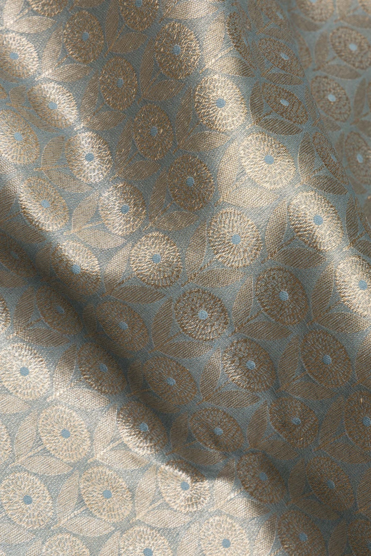 Close up of Pure Silk Grey Dual Tone Chanderi Saree with Zari Brocade on the body and Zari Border.  displaying folds