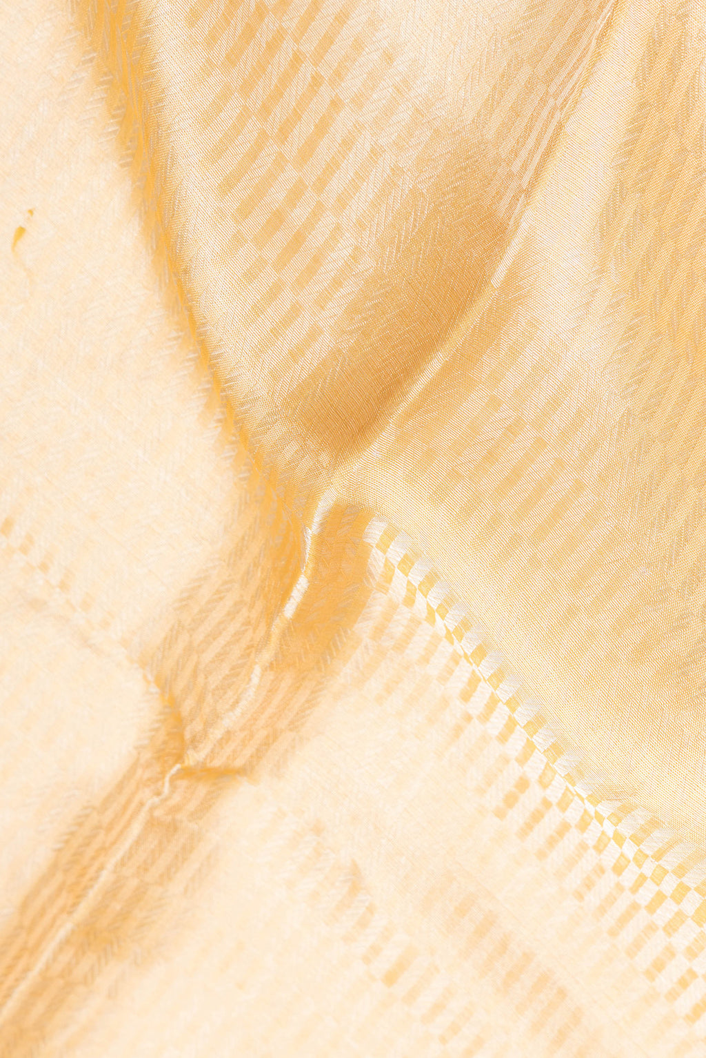 Close up of Pure Silk Mustard Dual Tone Banarasi Saree with Zari Brocade on the body and Zari Border.  displaying folds