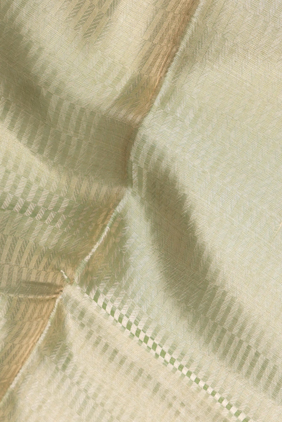 Close up of Pure Silk Green Dual Tone Banarasi Saree with Zari Brocade on the body and Zari Border.  displaying folds