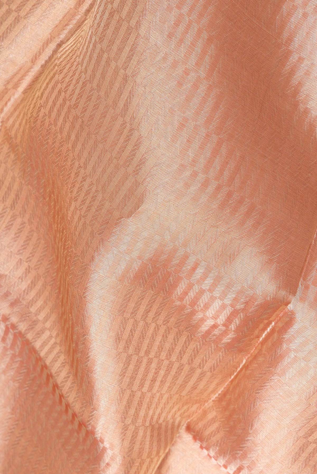 Close up of Pure Silk Rose Gold Dual Tone Banarasi Saree with Zari Brocade on the body and Zari Border.  displaying folds