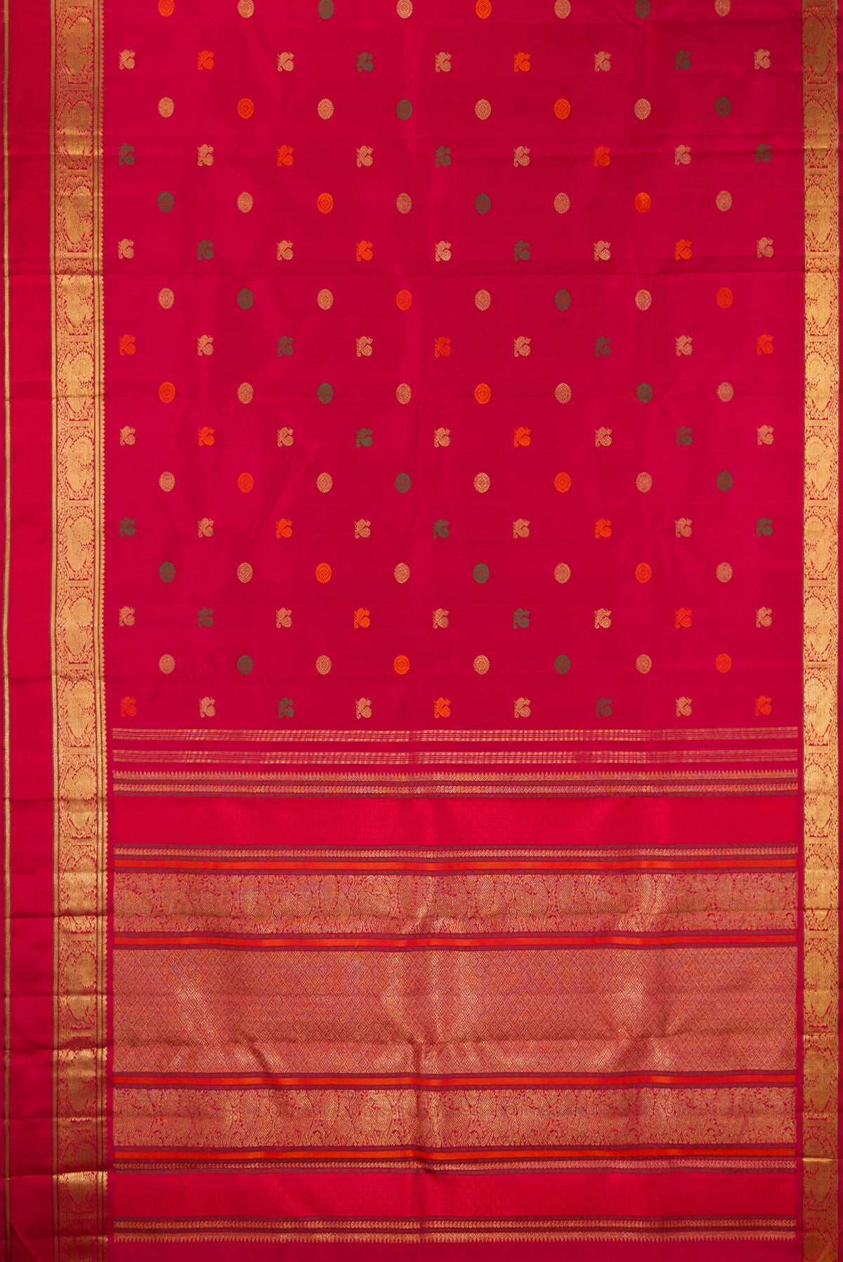 Flat view of Pure Silk Pure Zari Deep Red Kanjivaram Saree with Zari And Thread Butta on the body and Zari Border. 