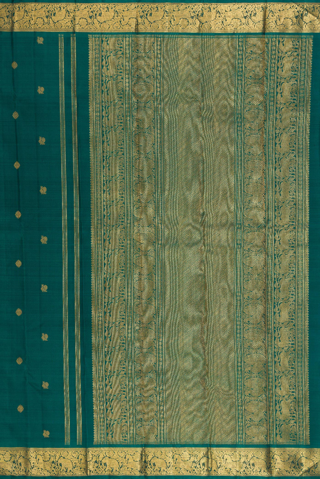 Close up image of the pallu of Pure Silk Pure Zari Green Kanjivaram Saree with Zari Butta on the body and Zari Border. 