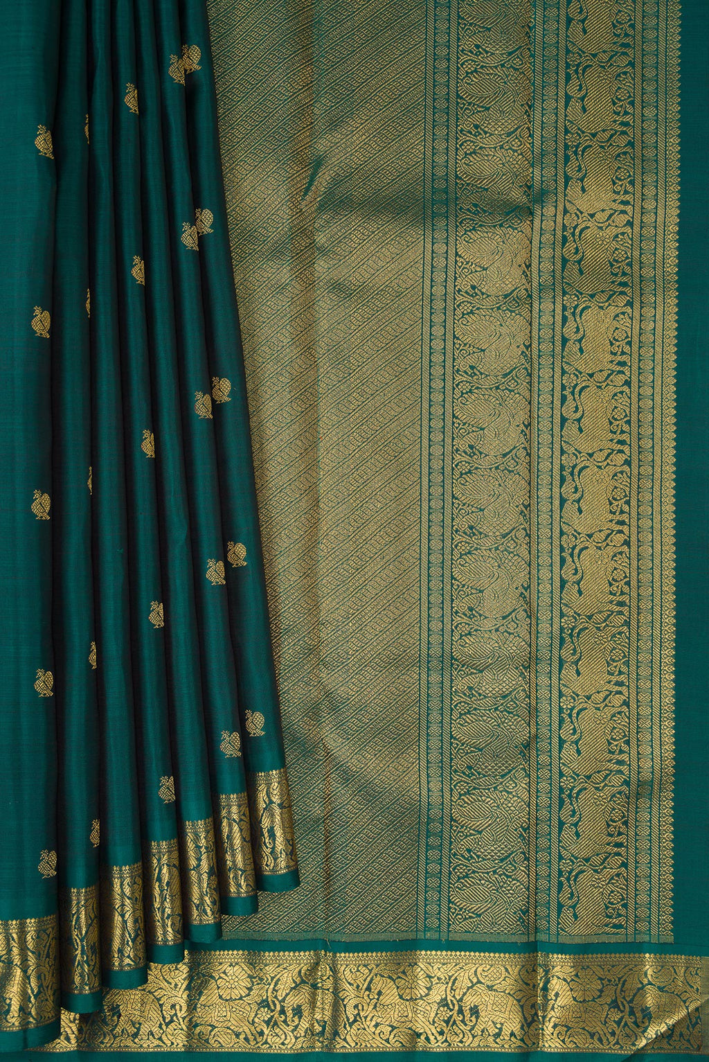 Pleats and pallu of Pure Silk Pure Zari Green Kanjivaram Saree with Zari Butta on the body and Zari Border. 