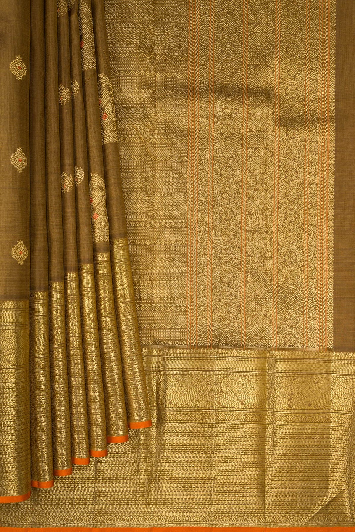 Pleats and pallu of Pure Silk Pure Zari Mehandi Green Kanjivaram Saree with Zari Butta on the body and Zari Border. 