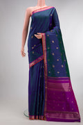 Pure Silk Pure Zari Peacock Blue Dual Tone Kanchipuram Saree with Zari Butta on the body and Zari Border.  displayed on a mannequin