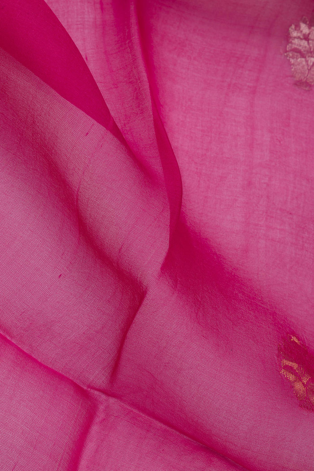Close up of Pure Silk Dark Pink Dual Tone Tussar Saree with Zari Butta on the body and Fancy Border.  displaying folds