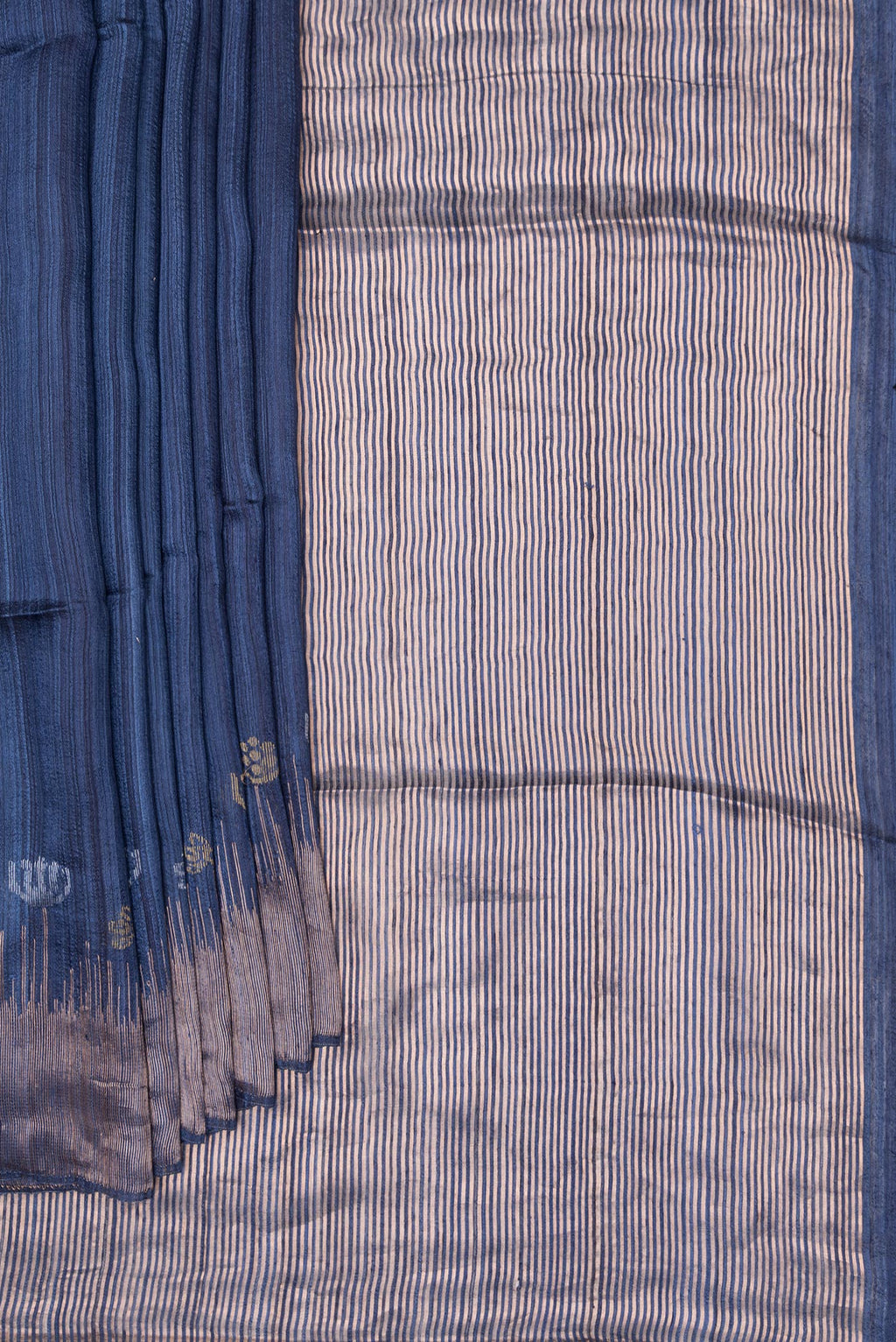 Pleats and pallu of Navy Blue Tussar Saree with Plain Body and Zari Border. 