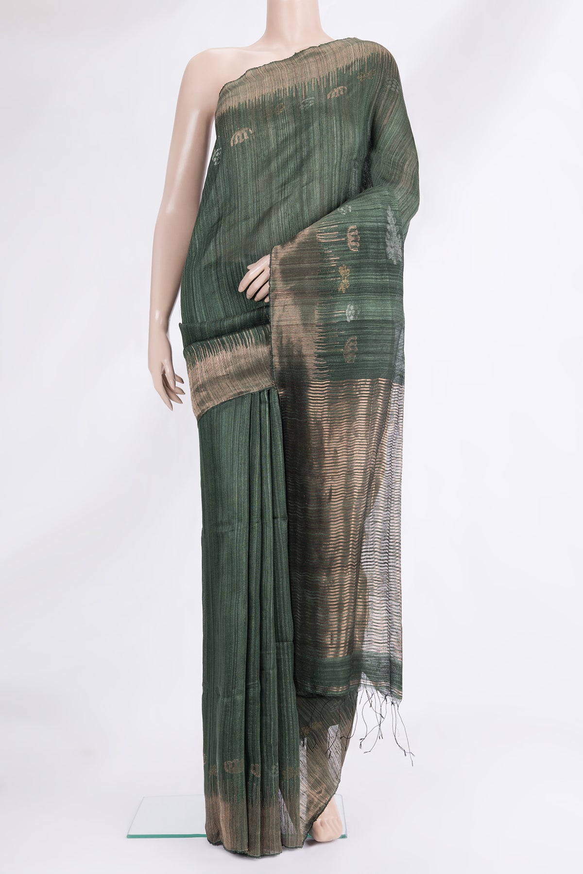 Bottle Green Tussar Saree with Zari Butta on the body and Fancy Border.  displayed on a mannequin