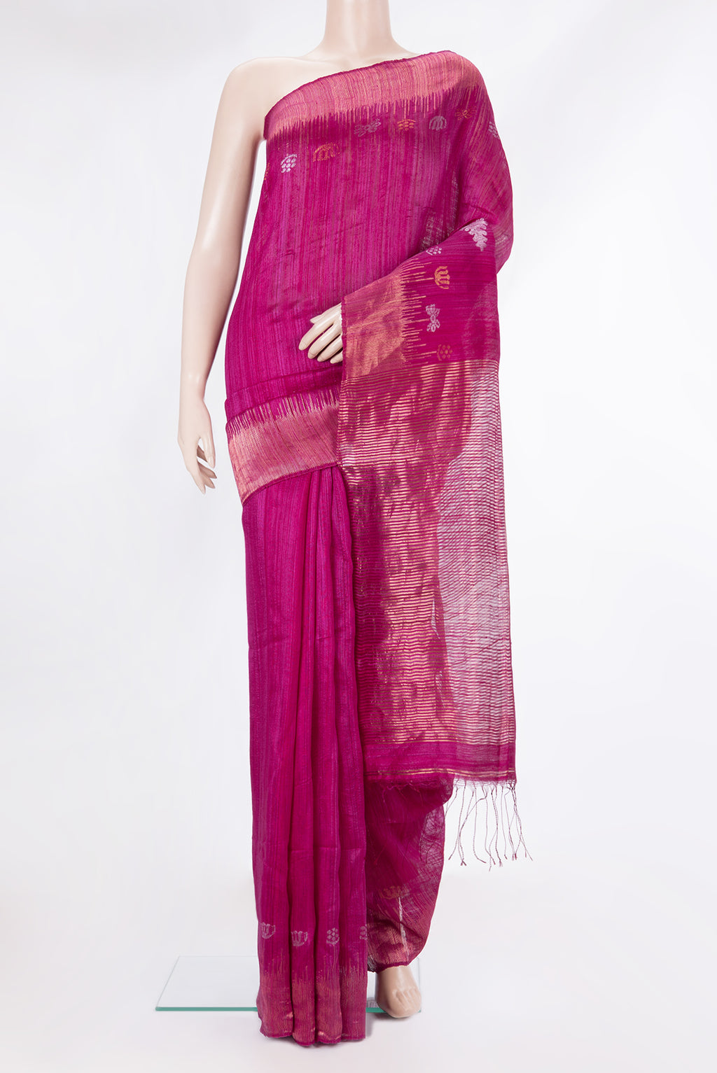 Magenta Tussar Saree with Zari Butta on the body and Fancy Border.  displayed on a mannequin