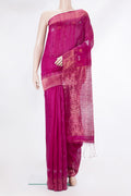 Magenta Tussar Saree with Zari Butta on the body and Fancy Border.  displayed on a mannequin