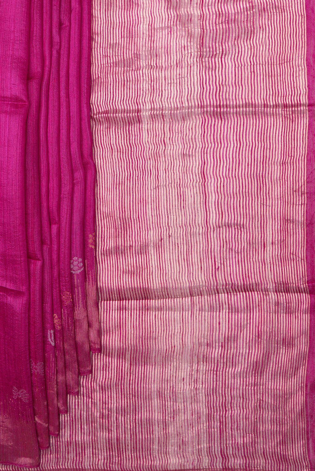 Pleats and pallu of Magenta Tussar Saree with Zari Butta on the body and Fancy Border. 