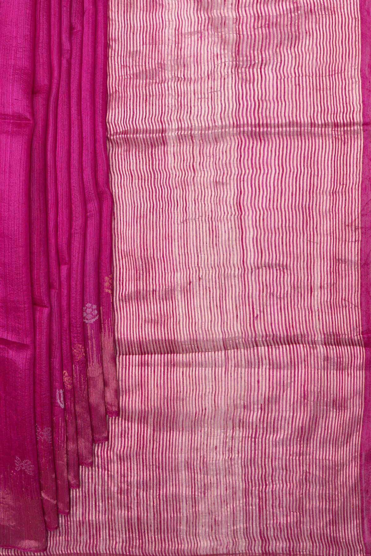 Pleats and pallu of Magenta Tussar Saree with Zari Butta on the body and Fancy Border. 