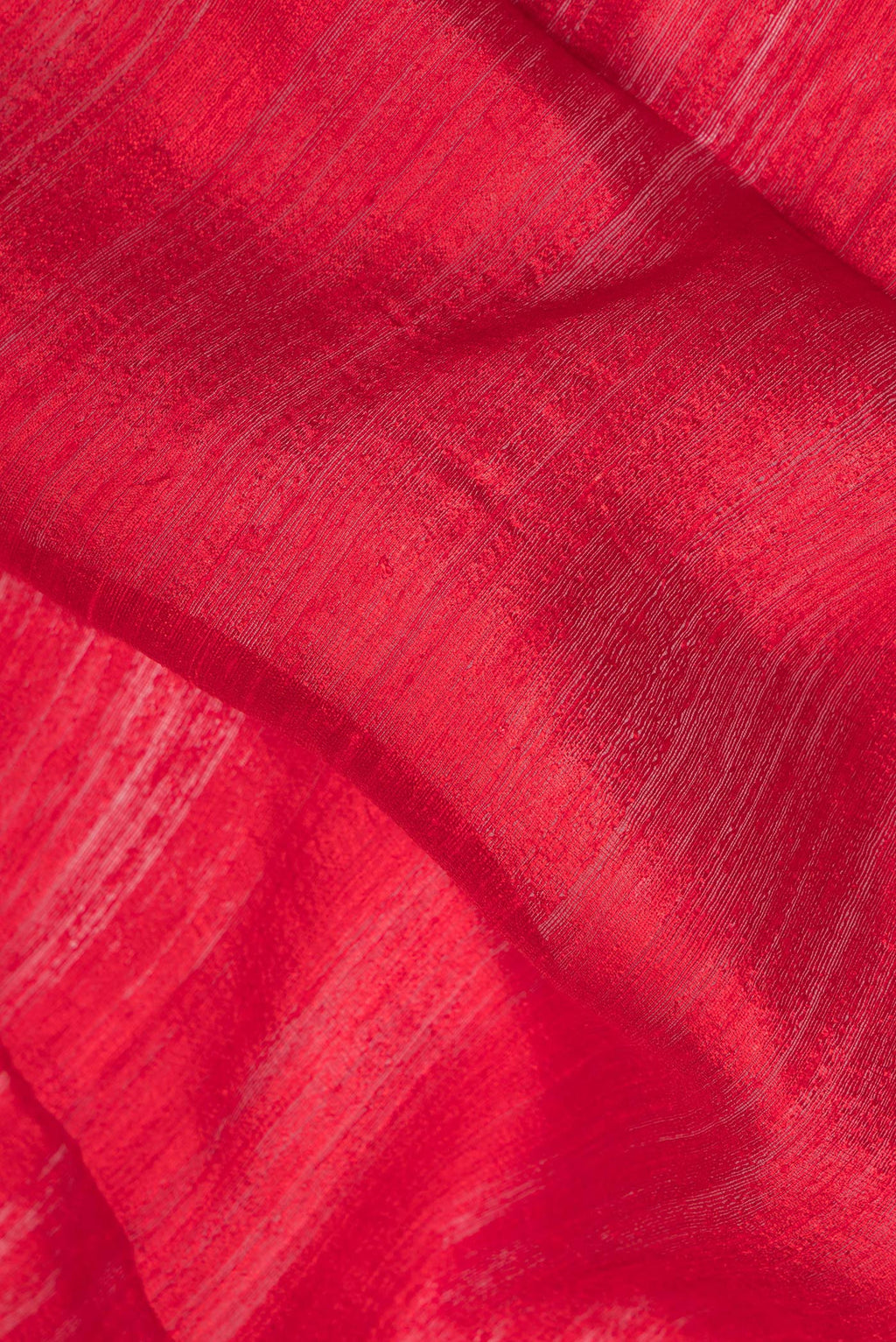 Close up of Pure Silk Maroon Dual Tone Jute Saree with Zari Butta on the body and Fancy Border.  displaying folds