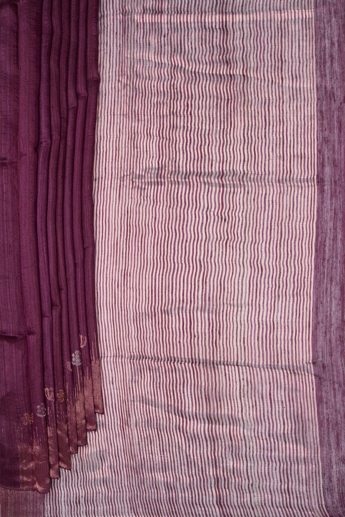 Pleats and pallu of Pure Silk Purple Dual Tone Jute Saree with Zari Butta on the body and Fancy Border. 