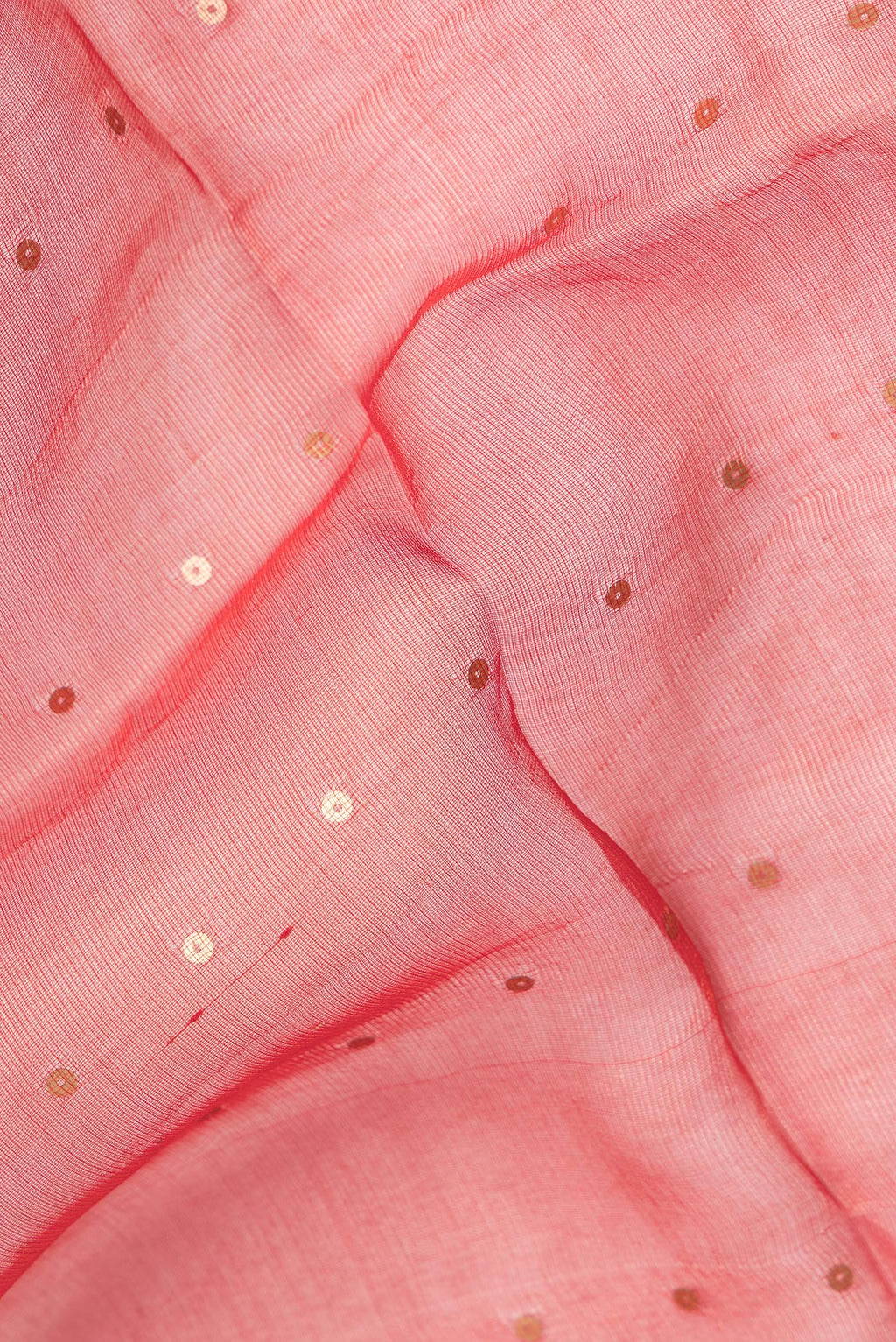 Close up of Pure Silk Red Tussar Saree with Embroidery on the body and Zari Border.  displaying folds