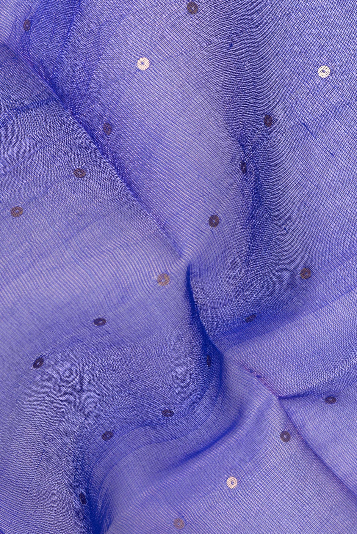 Close up of Pure Silk Royal Blue Tussar Saree with Embroidery on the body and Zari Border.  displaying folds