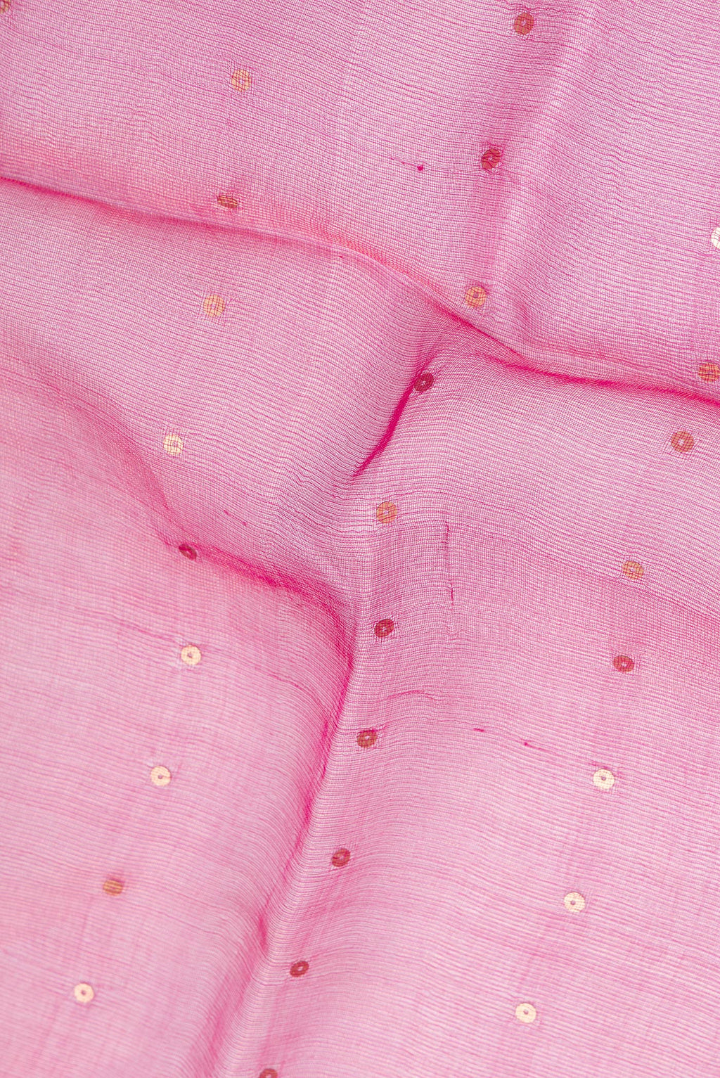 Close up of Pure Silk Dark Pink Dual Tone Tussar Saree with Embroidery on the body and Zari Border.  displaying folds