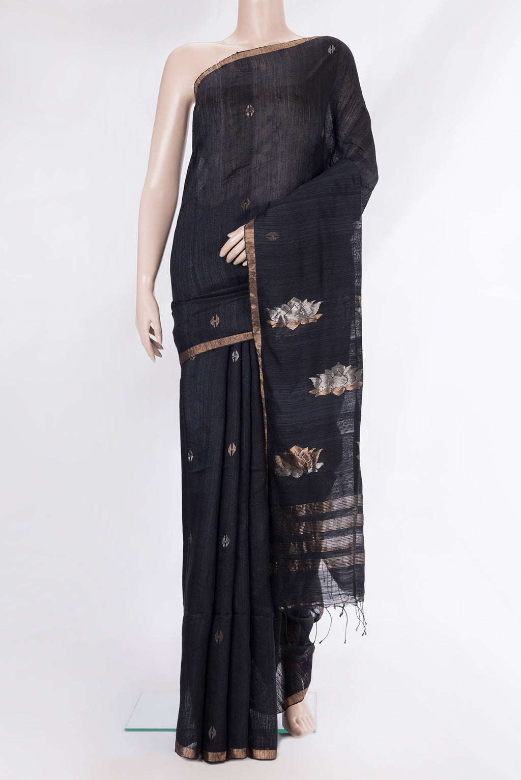 Pure Silk Black Tussar Saree with Plain Body and Zari Border.  displayed on a mannequin