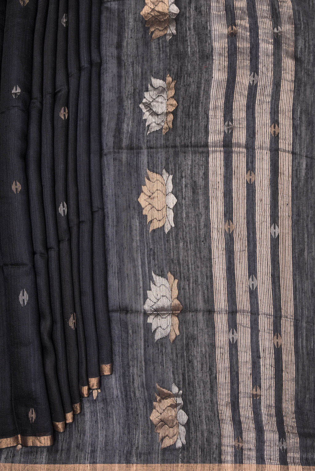 Pleats and pallu of Pure Silk Black Tussar Saree with Plain Body and Zari Border. 