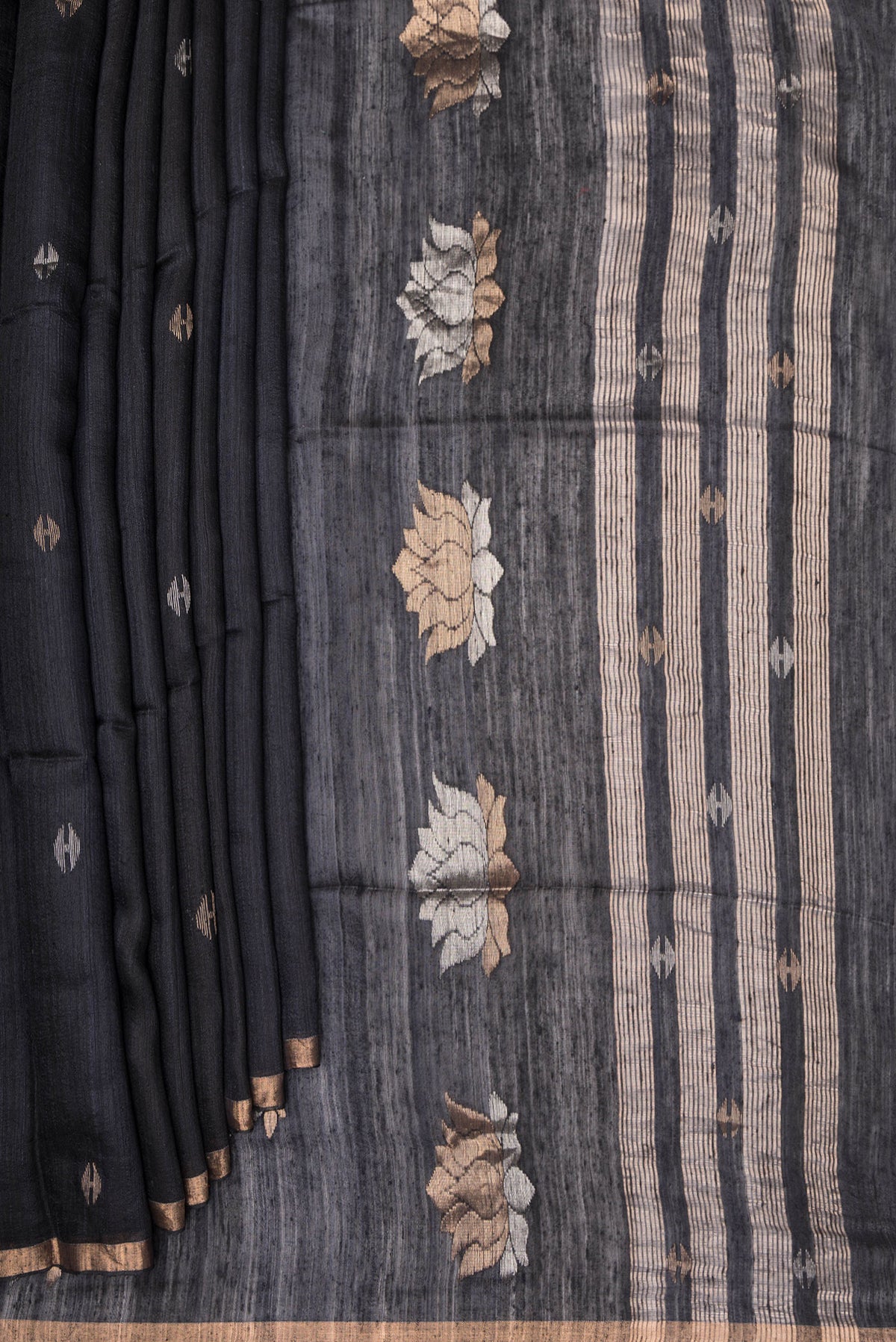 Pleats and pallu of Pure Silk Black Tussar Saree with Plain Body and Zari Border. 