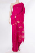 Pure Silk Pink Tussar Saree with Zari Butta on the body and Zari Border.  displayed on a mannequin