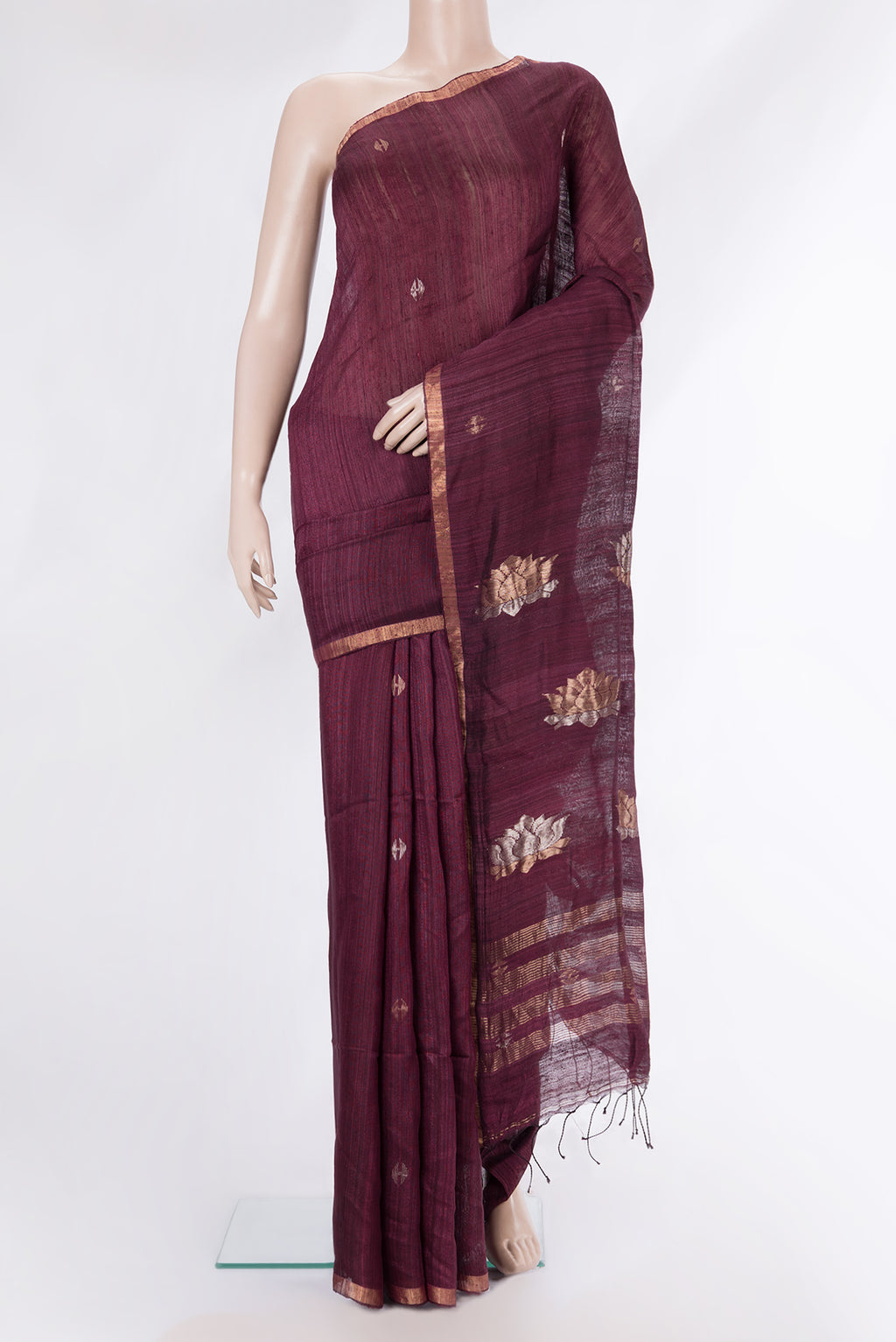 Pure Silk Brown Tussar Saree with Zari Butta on the body and Zari Border.  displayed on a mannequin