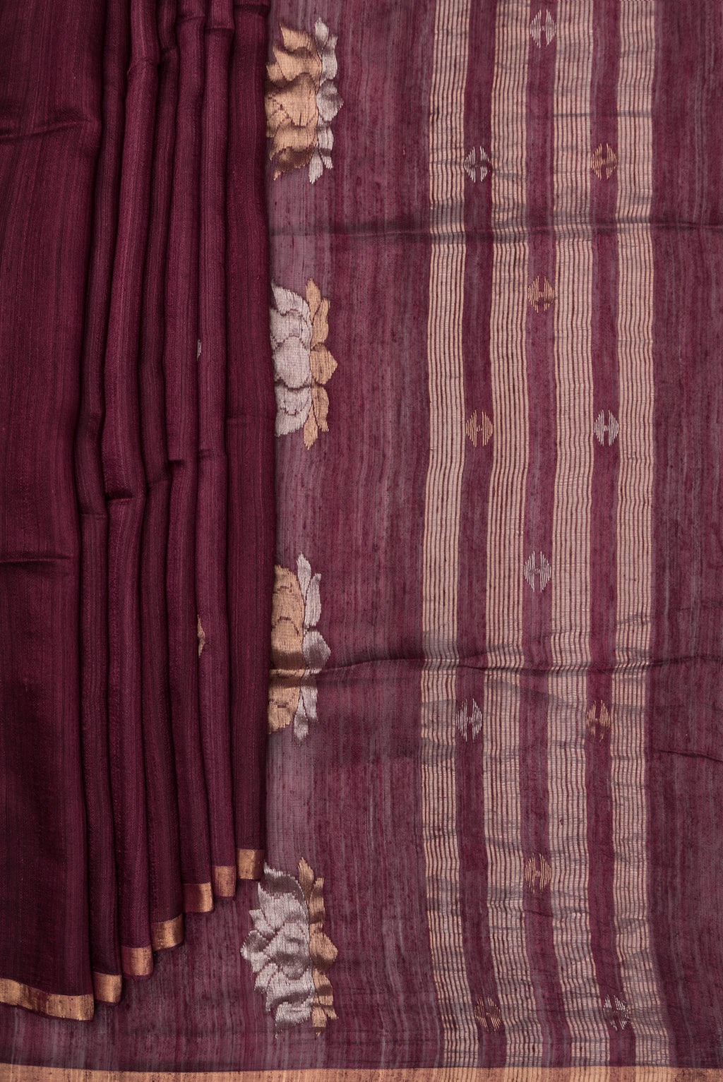 Pleats and pallu of Pure Silk Brown Tussar Saree with Zari Butta on the body and Zari Border. 