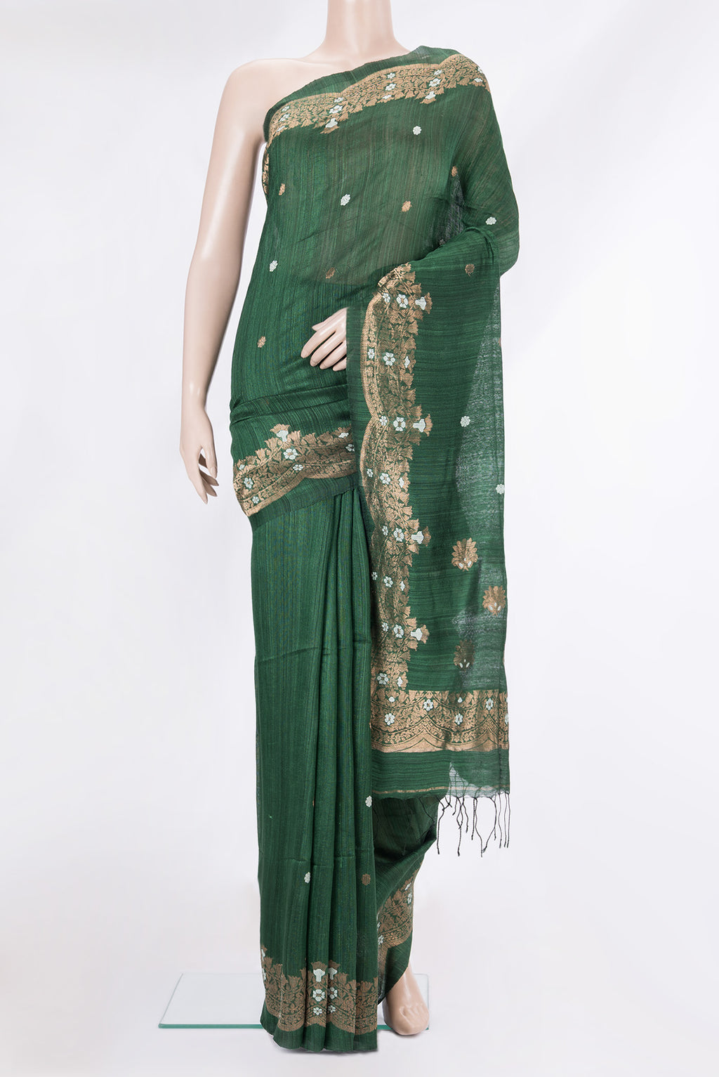 Pure Silk Bottle Green Tussar Saree with Zari Butta on the body and Fancy Border.  displayed on a mannequin