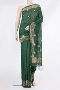 Pure Silk Bottle Green Tussar Saree with Zari Butta on the body and Fancy Border.  displayed on a mannequin