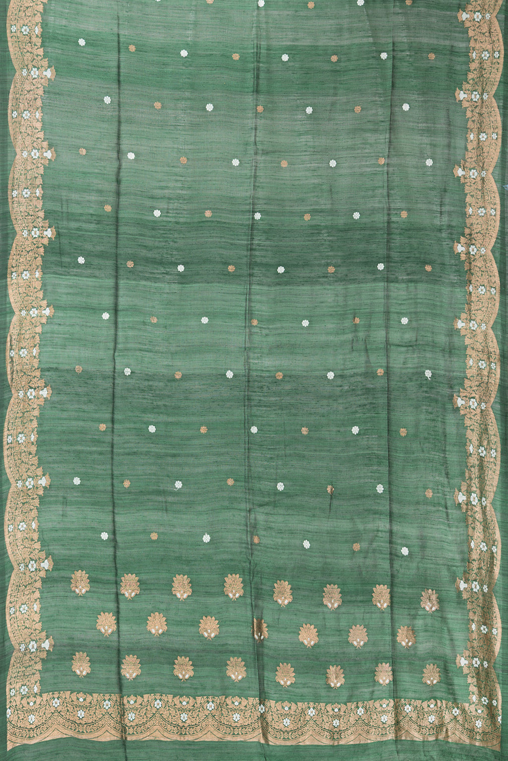 Flat view of Pure Silk Bottle Green Tussar Saree with Zari Butta on the body and Fancy Border. 