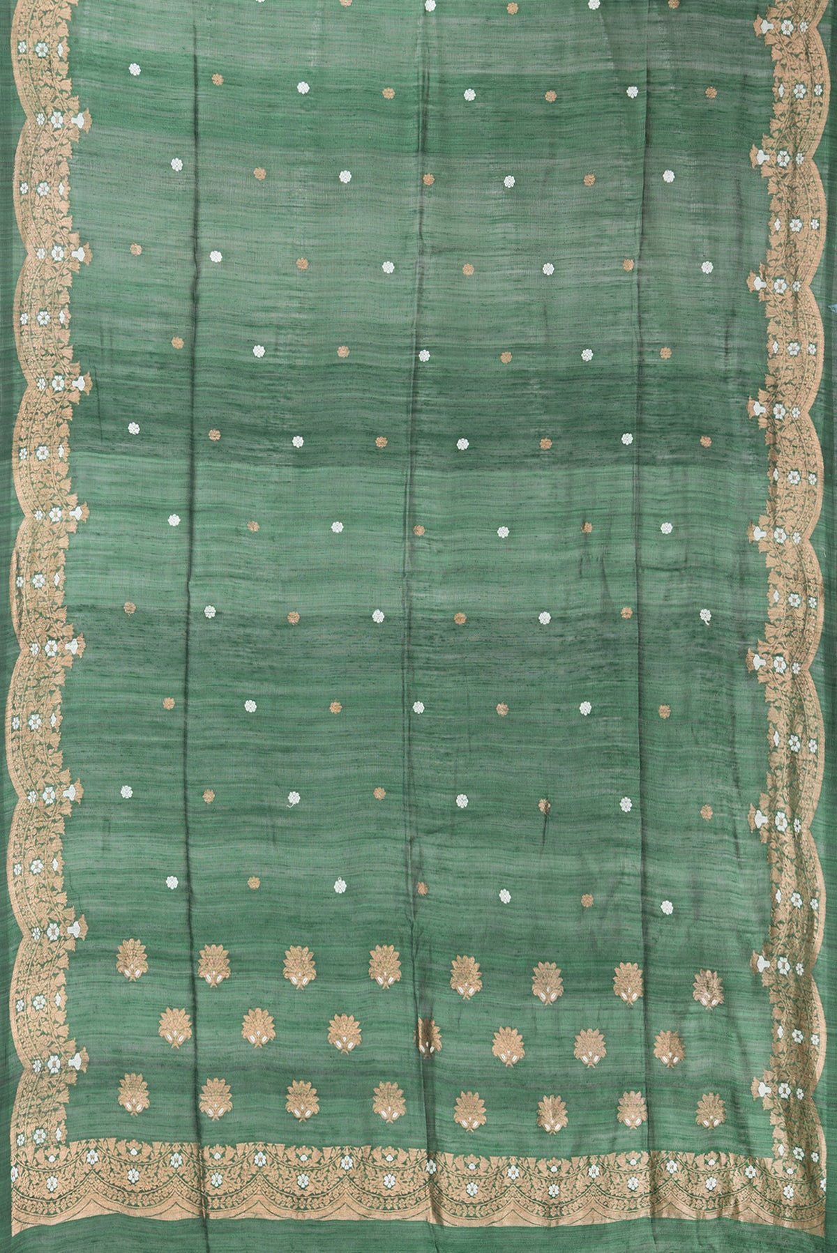 Flat view of Pure Silk Bottle Green Tussar Saree with Zari Butta on the body and Fancy Border. 