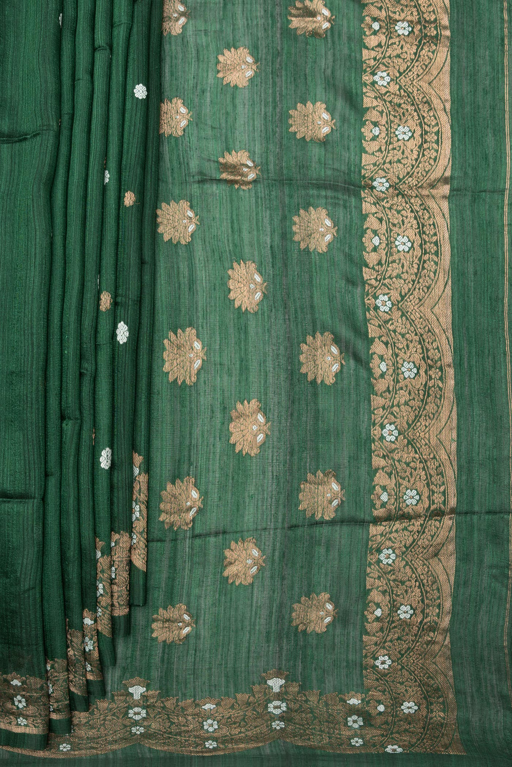 Pleats and pallu of Pure Silk Bottle Green Tussar Saree with Zari Butta on the body and Fancy Border. 