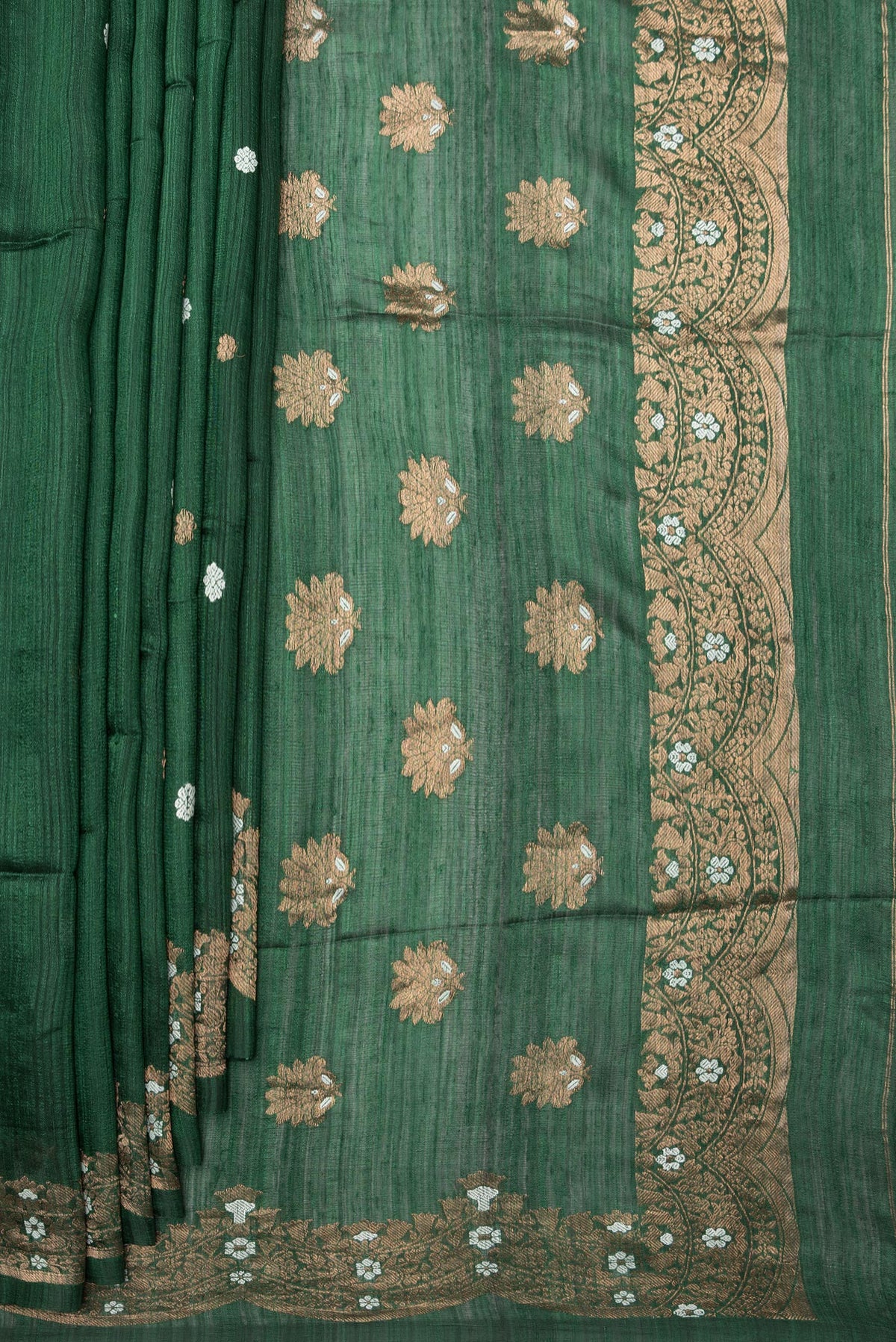 Pleats and pallu of Pure Silk Bottle Green Tussar Saree with Zari Butta on the body and Fancy Border. 