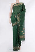 Green Tussar Saree with Zari Butta on the body and Fancy Border.  displayed on a mannequin