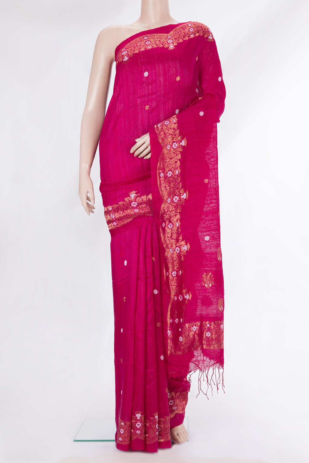 Pure Silk Pink Tussar Saree with Zari Butta on the body and Zari Border.  displayed on a mannequin