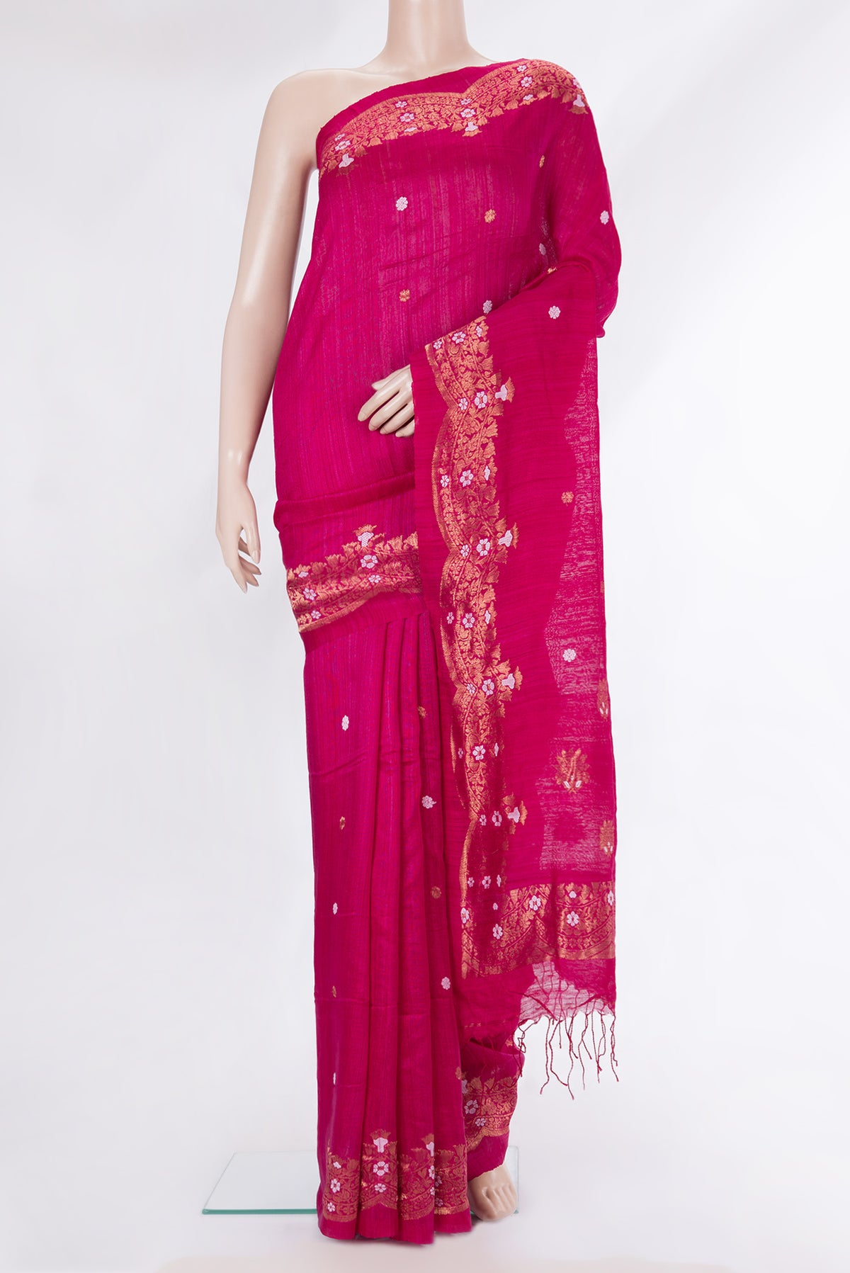Pure Silk Pink Tussar Saree with Zari Butta on the body and Zari Border.  displayed on a mannequin
