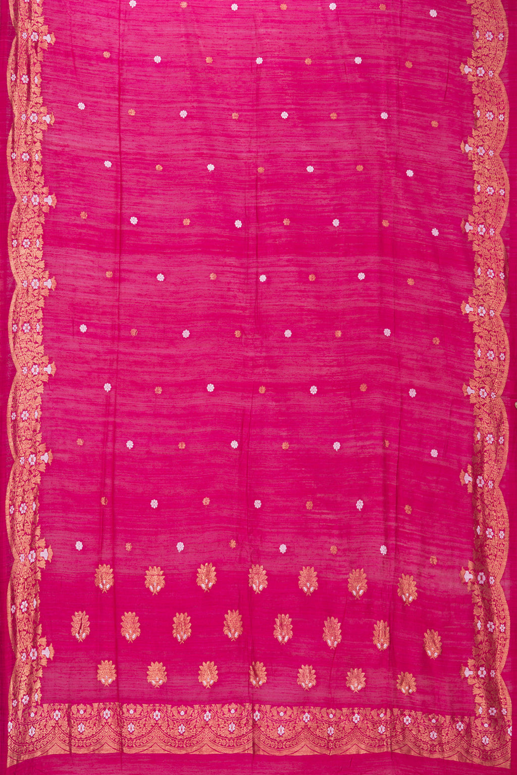 Flat view of Pure Silk Pink Tussar Saree with Zari Butta on the body and Zari Border. 