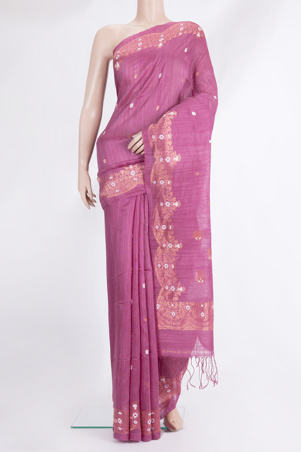 Pink Tussar Saree with Zari Butta on the body and Fancy Border.  displayed on a mannequin