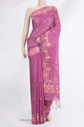 Pink Tussar Saree with Zari Butta on the body and Fancy Border.  displayed on a mannequin
