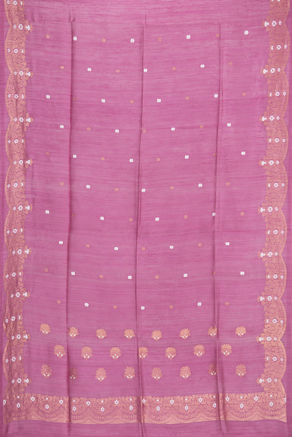 Flat view of Pink Tussar Saree with Zari Butta on the body and Fancy Border. 