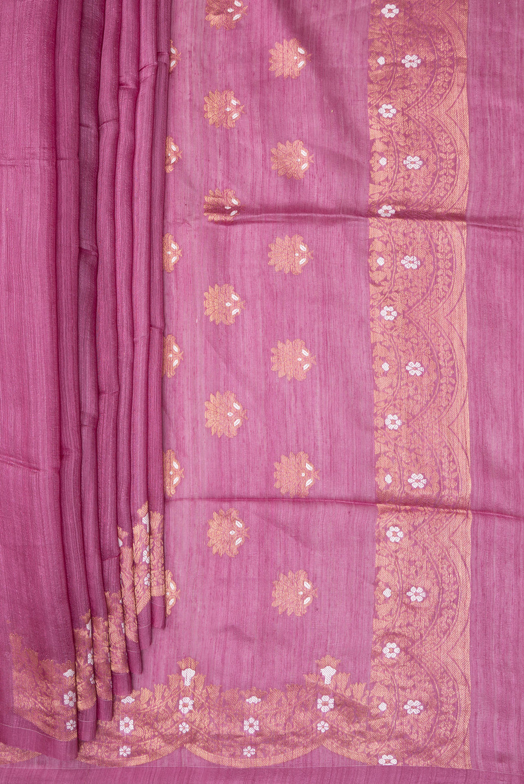 Pleats and pallu of Pink Tussar Saree with Zari Butta on the body and Fancy Border. 