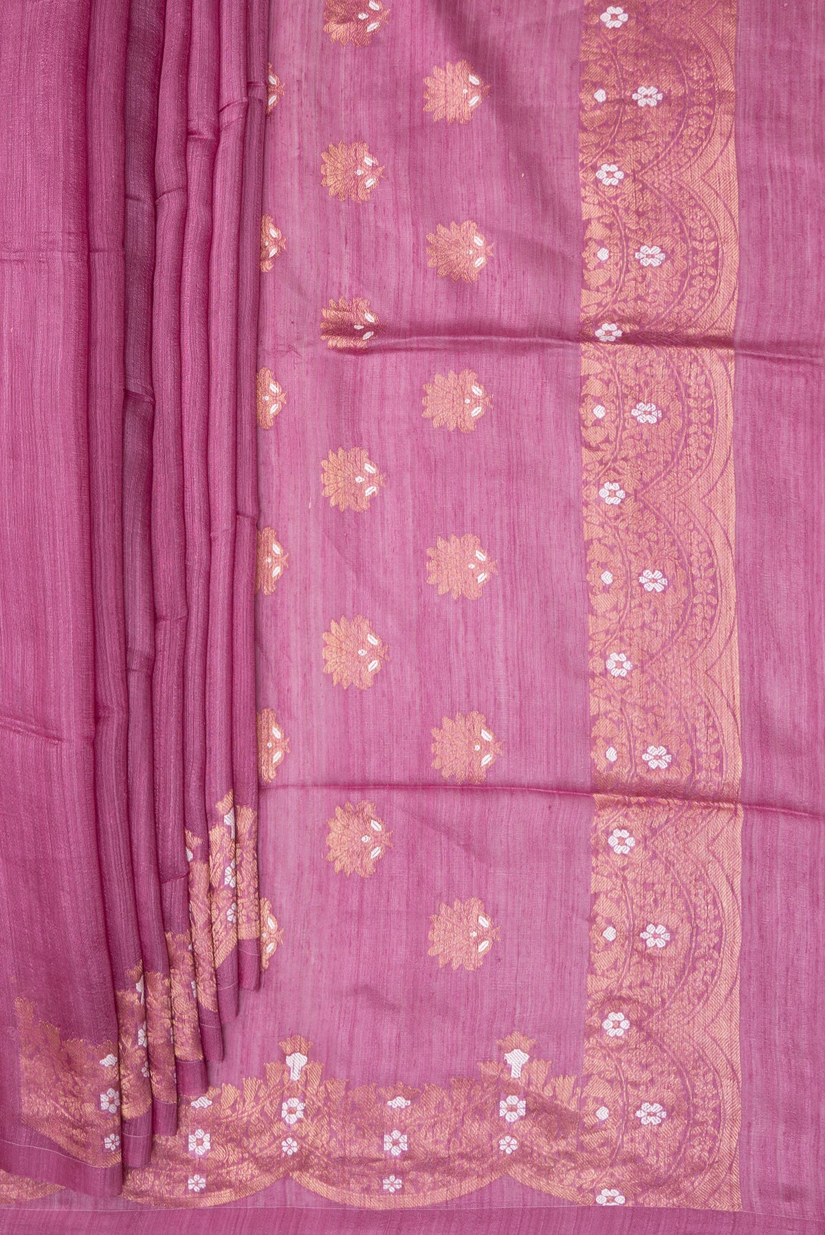 Pleats and pallu of Pink Tussar Saree with Zari Butta on the body and Fancy Border. 
