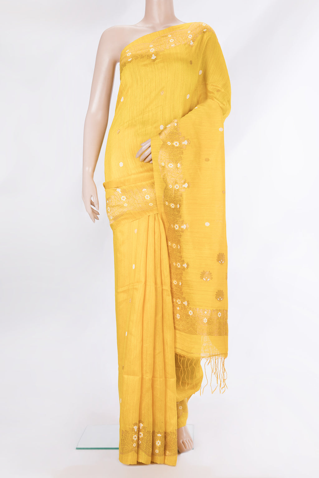 Pure Silk Lemon Yellow Tussar Saree with Zari Butta on the body and Fancy Border.  displayed on a mannequin
