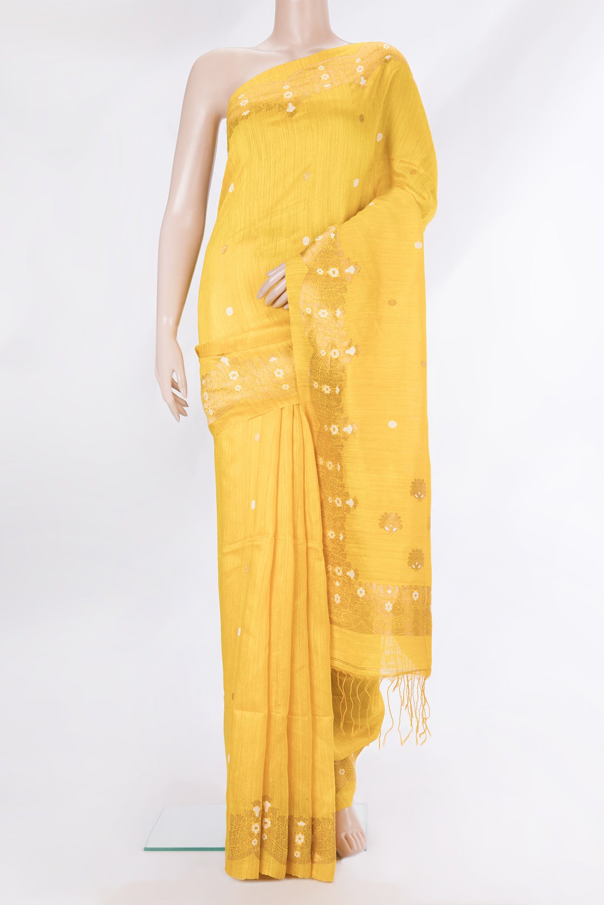 Pure Silk Lemon Yellow Tussar Saree with Zari Butta on the body and Fancy Border.  displayed on a mannequin
